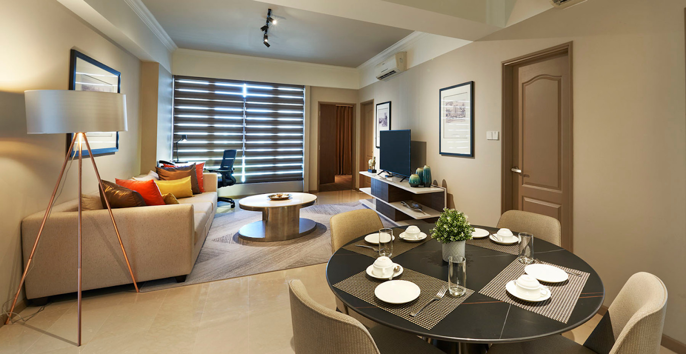 A furnished apartment living and dining area
