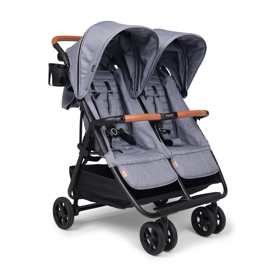 A grey side-by-side double stroller with brown handlebars